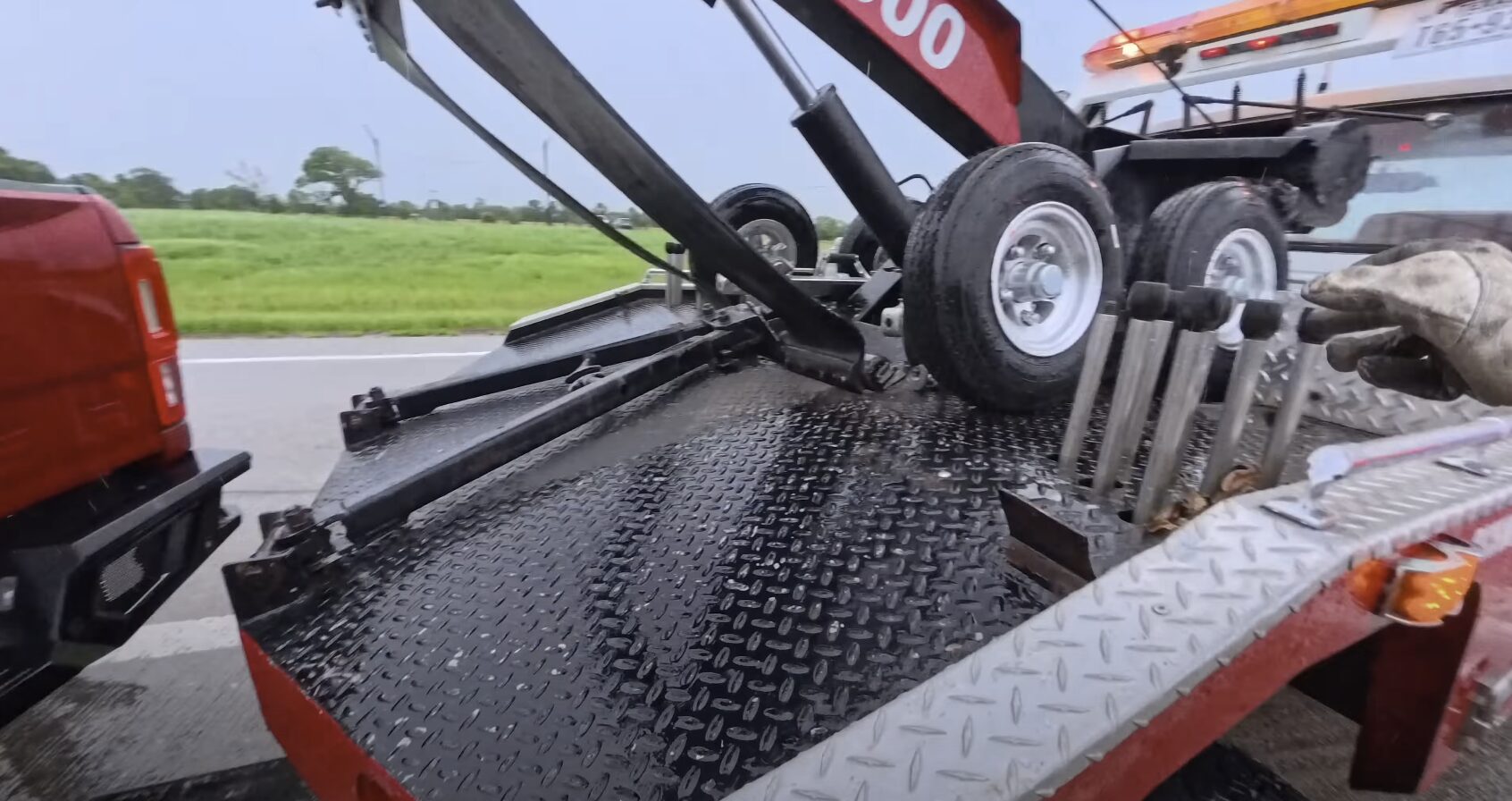 Professional Highway Breakdown Assistance in Friendswood, TX Heavy-duty tow truck on roadway showing professional equipment